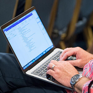 Man typing on computer at the 2019 Biennial Conference