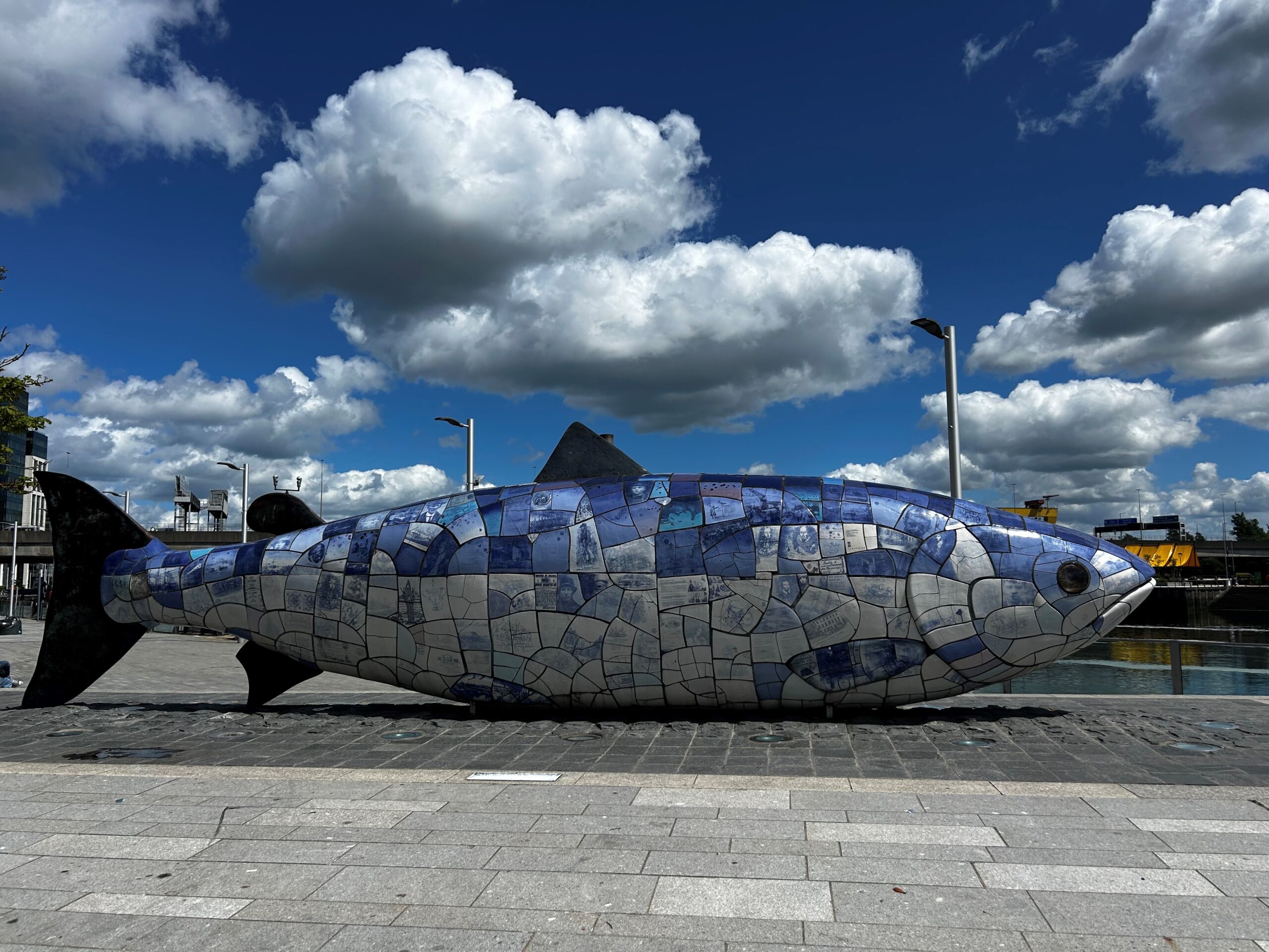 Salmon sculpture composed of a mosaic of historical events and important people in Belafast.